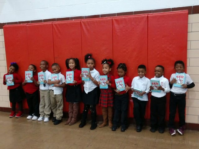 River Roads students smile with their new Bibles in hand.