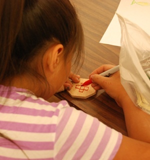 A girl working on a VBS craft project A girl working on a VBS craft project