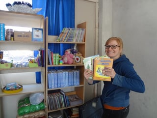 A missionary filling the church's brand-new library