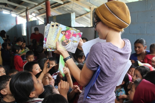 These eager children can't wait to get their hands on their new books!