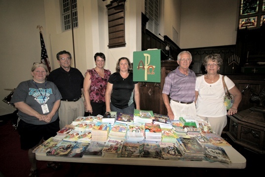 Chapel guests with the donated books Chapel guests with the donated books