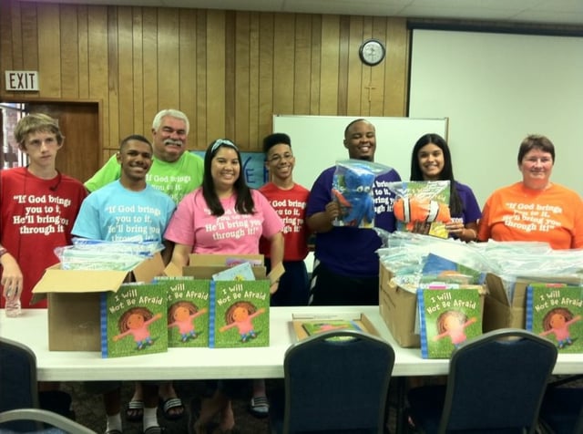 Volunteers packing donated books