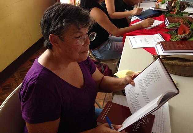 One of the deaconesses reading a book from CGO