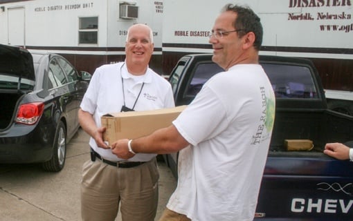 Volunteers delivering donated books from CGO