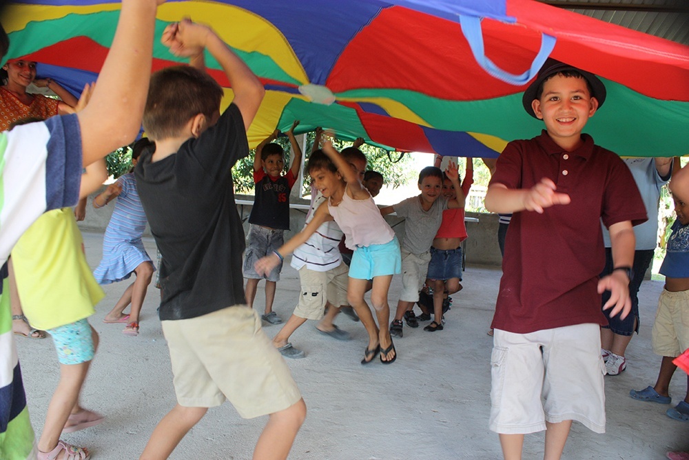 Play time! The missionaries brought this parachute along to have fun with the kids.